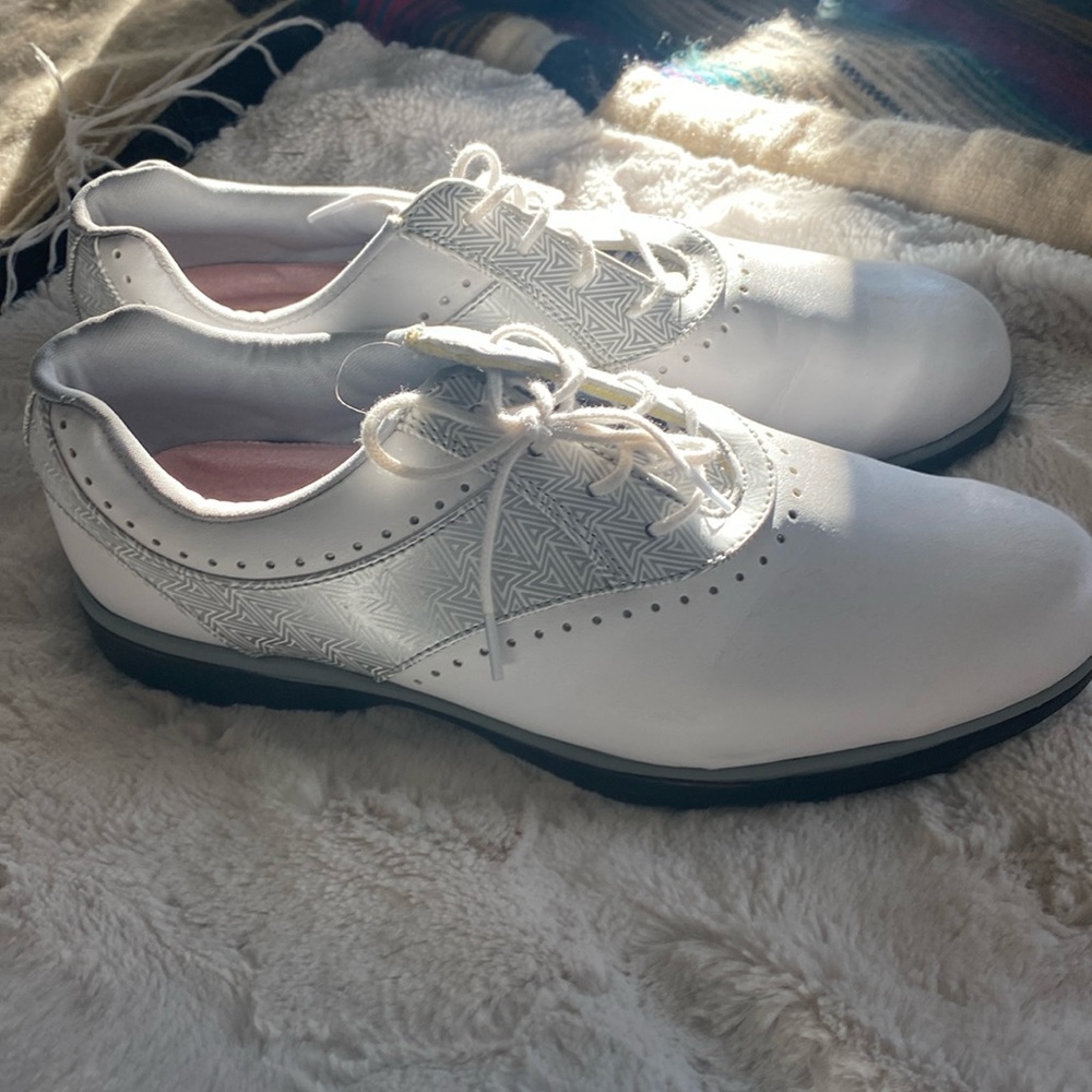 Emerge brand women’s golf shoes. White leather lace up